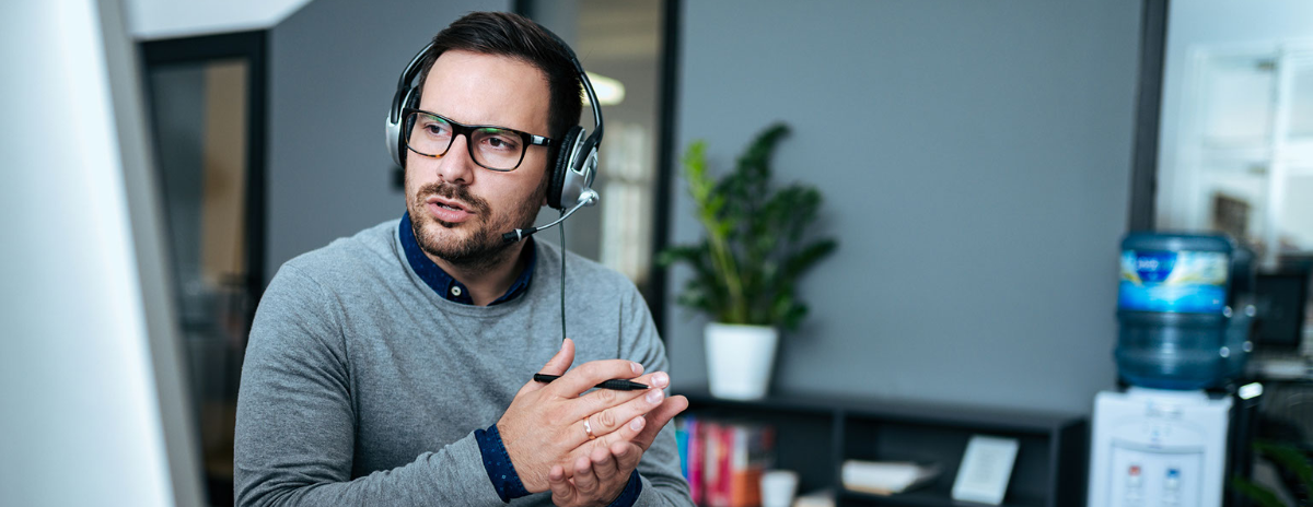 Man wearing headset providing IT Desktop support